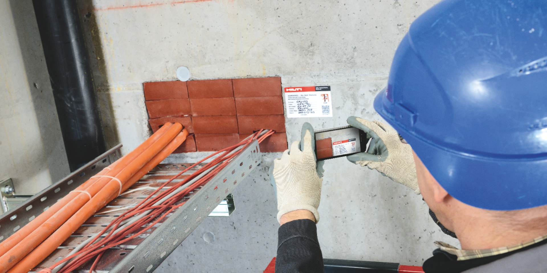 Person taking a picture of a QR code with mobile phone